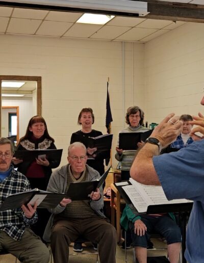 Andrew Walker leading a choral in rehearsal