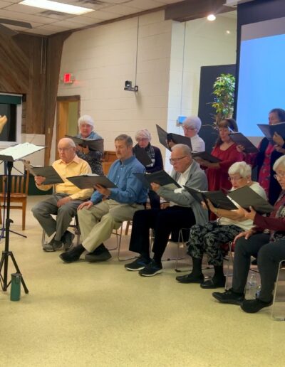 Andrew Walker leading a choral in rehearsal