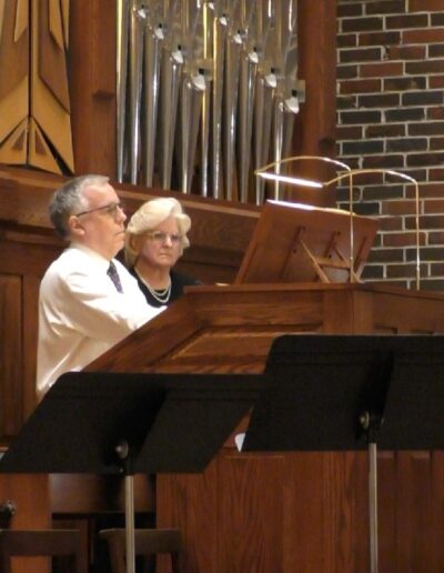 Andrew Walker playing a pipe organ in church