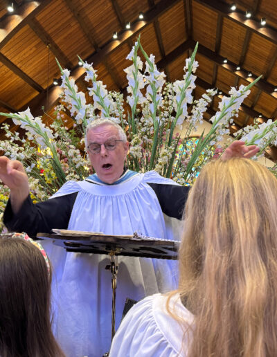 Andrew Walker Conducting a choir